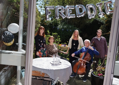   Freddie Knoller was born in 1921 in Vienna. In 1938 he left to live as a refugee in Belgium and France.     He moved to London and started a family in the 1950s. Freddie was photographed at home on his 100th Birthday with his wife Freda, his daughters Susie and Marcia and his grandson Nadav.     Freddie still plays the cello.    - © Frederic Aranda